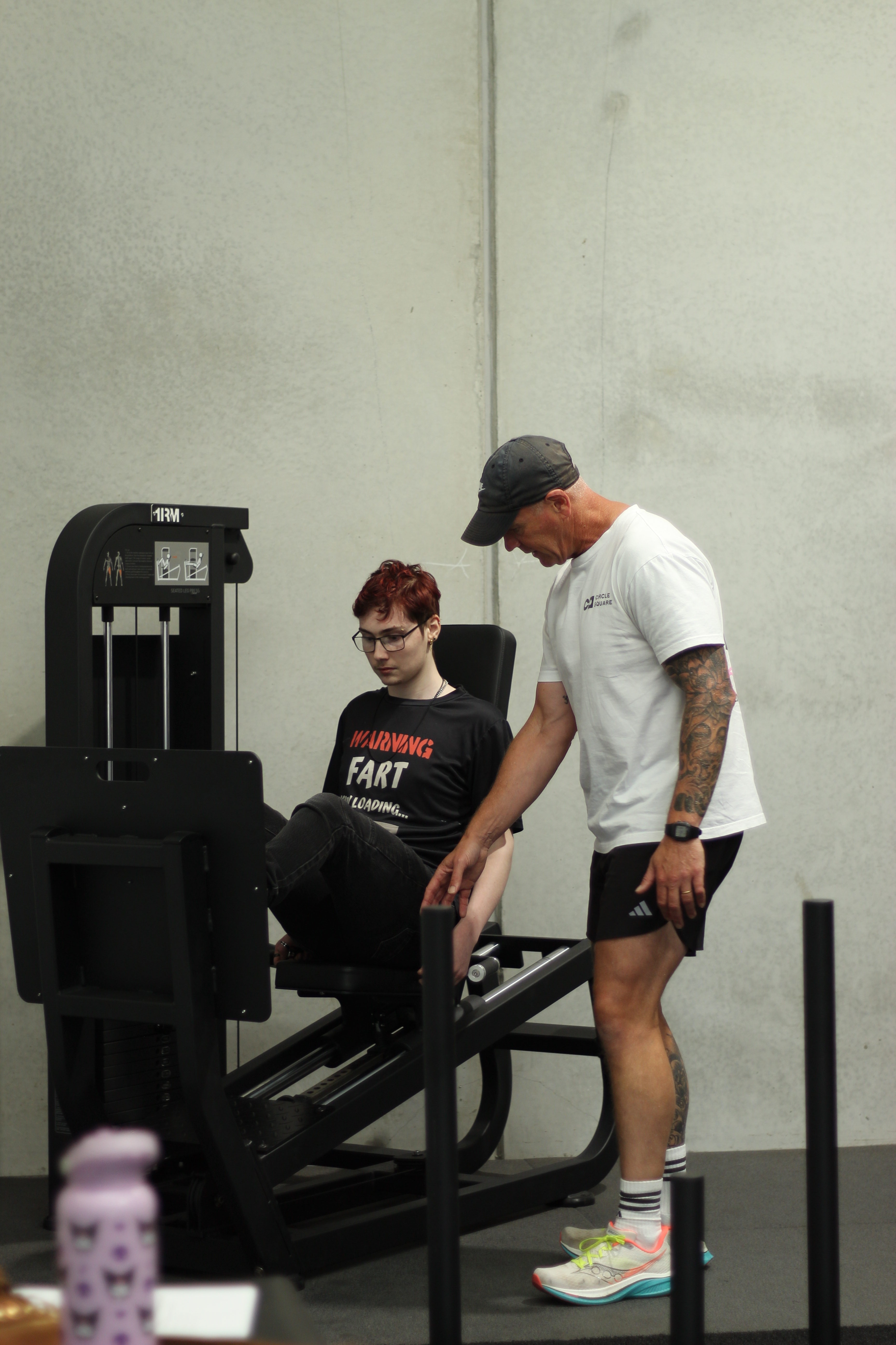 Trainer assisting participant